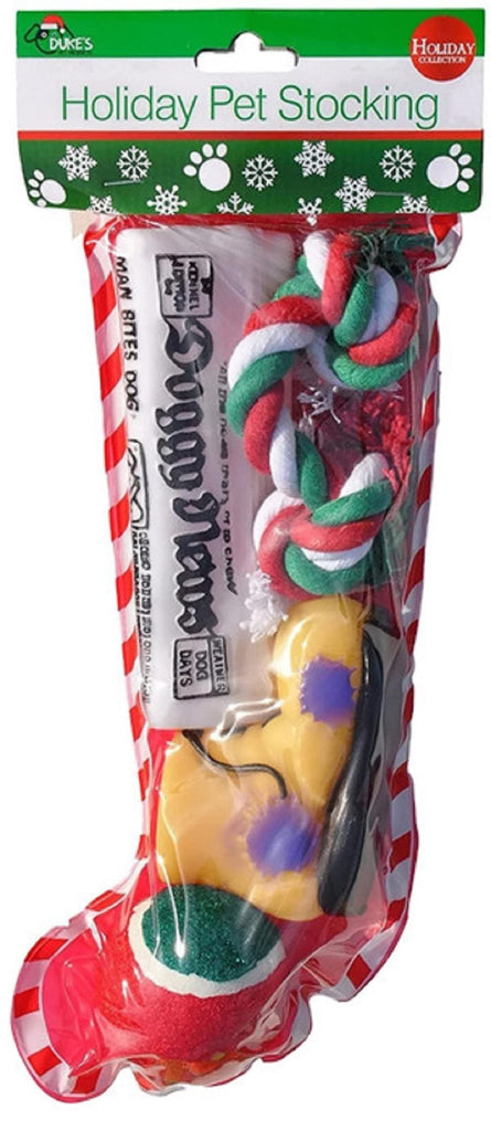 Christmas Stocking for Dogs. Squeaky newspaper / boot toy, a red, green and white tennis ball and a red, white and green cotton knotted rope.
